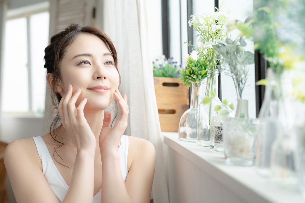 Woman enjoying refreshed skin after BioRePeel treatment.