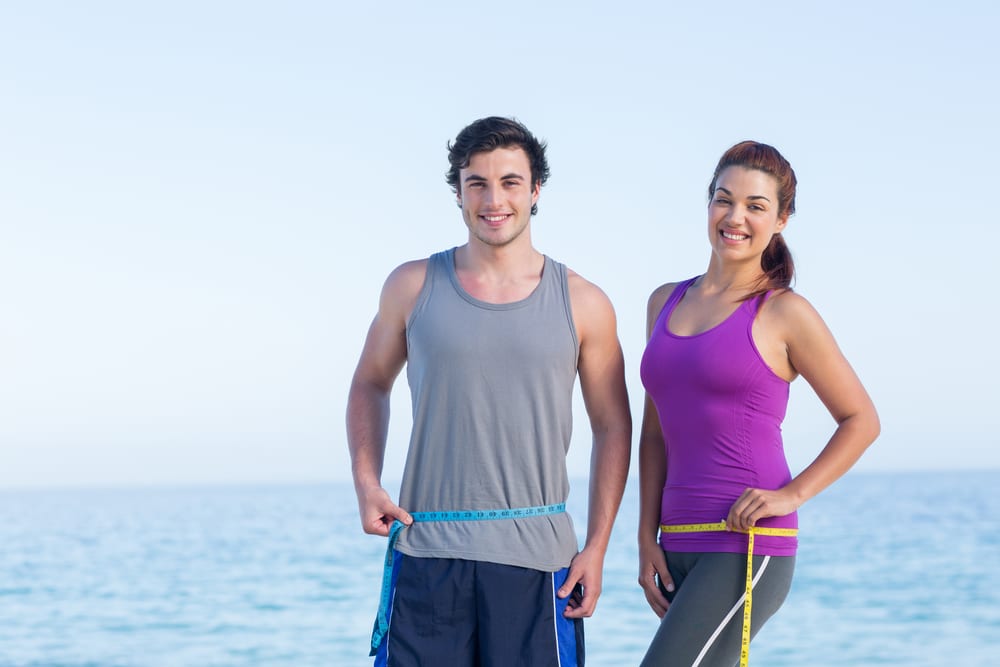 Patients at TRU Medical Aesthetics & Wellness measuring waistlines.